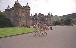 IMage of runners in the grounds of Holyrood Palace